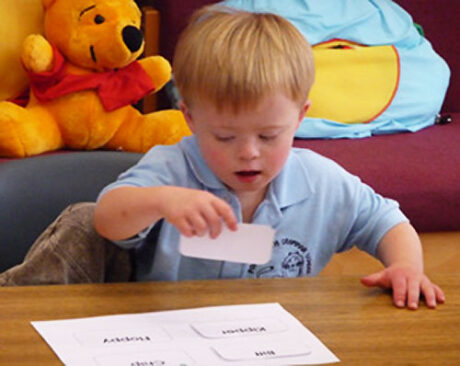 Boy matching word cards